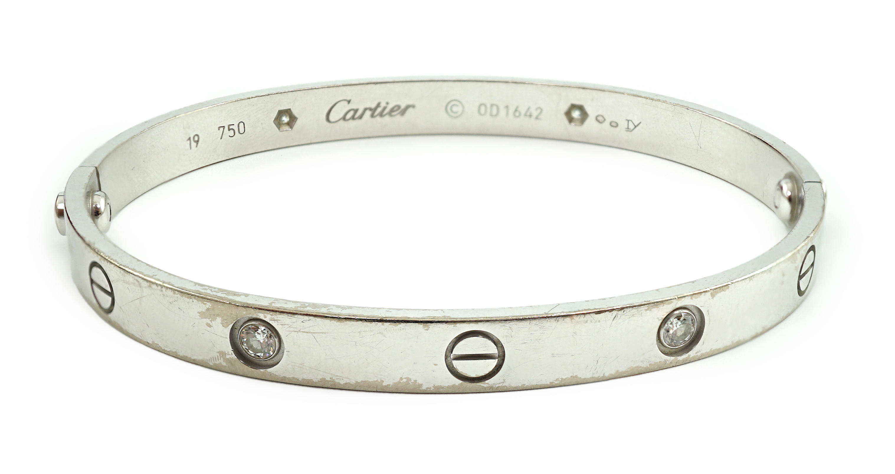 A modern Cartier 750 white gold and four stone gypsy set diamond 'Love' bangle